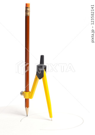 Yellow compass with pencil isolated on white background Yellow compass with pencil isolated on white background 123582141