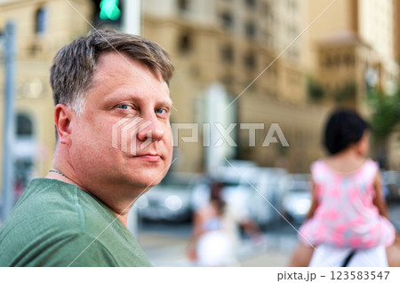 Portrait of a man close-up face in an urban environment 123583547