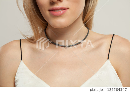 Shiny jewelry necklace choker on beautiful female neck 123584347