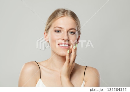 Cute blond model woman portrait. Beautiful face with healthy clear skin, long shiny hair  123584355