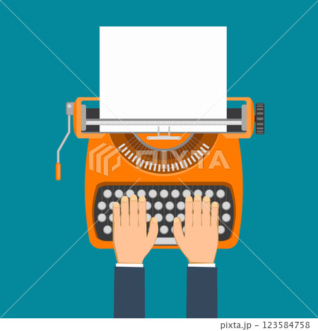 Human hands typing on vintage typewriter with paper 123584758