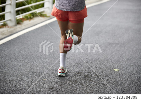 asian woman running outdoors asian woman running outdoors 123584809