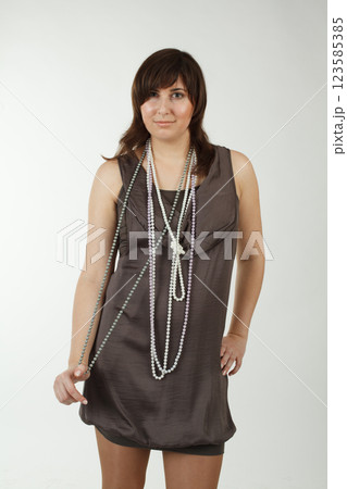 Standing brunette woman, retro style fashion beauty portrait Standing brunette woman, retro style fashion beauty portrait 123585385