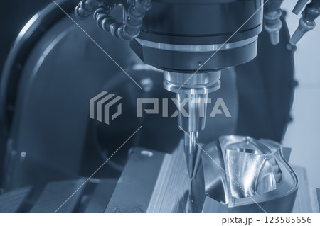 The 5-axis machining center cutting mold parts with solid barrel end mill tool in the light blue scene. The 5-axis machining center cutting mold parts with solid barrel end mill tool in the light blue scene. 123585656