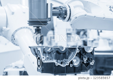 Closeup scene the milling spindle attached on the robotic arm finish cut the aluminum gear case. 123585657