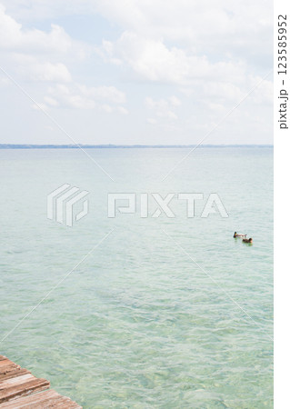Beautiful transparent water in Lago di Garda, Italy.  123585952
