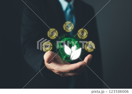 person hold to save energy,and reduce global warming,climate change,ecology friendly investment,ESG environment social governance,Green Business Innovation and Sustainable Development concept. person hold to save energy,and reduce global warming,climate change,ecology friendly investment,ESG environment social governance,Green Business Innovation and Sustainable Development concept. 123586006