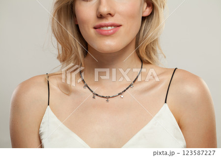 Fashion jewelry necklace on beautiful female neck 123587227
