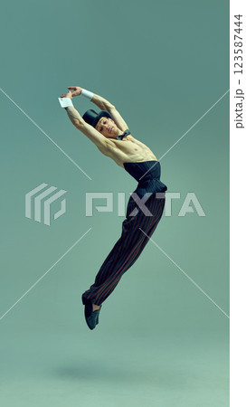 Majestic leap suspended in air, refined yet powerful stance embodying theatrical brilliance in vintage attire, radiating old-school charisma against artistic setting. Majestic leap suspended in air, refined yet powerful stance embodying theatrical brilliance in vintage attire, radiating old-school charisma against artistic setting. 123587444
