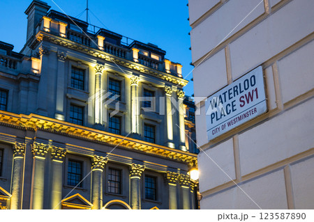 Illuminated Historic Building and Waterloo Place Street Sign at Dusk in London Illuminated Historic Building and Waterloo Place Street Sign at Dusk in London 123587890