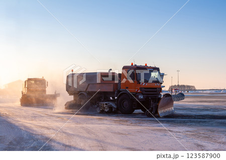 snowblowers cleans airport in the morning at winter 123587900