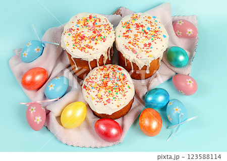 Abstract Easter composition, background. Holiday card with traditional Russian kulich with meringue and decorated with colorful marble eggs. Preparation for the holiday and Happy Easter concept. Abstract Easter composition, background. Holiday card with traditional Russian kulich with meringue and decorated with colorful marble eggs. Preparation for the holiday and Happy Easter concept. 123588114