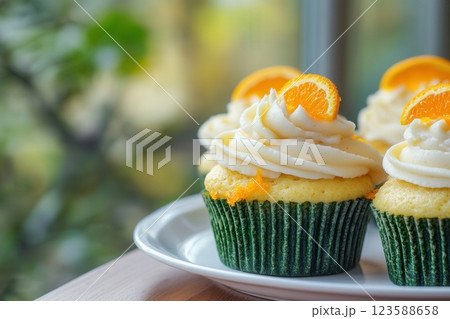 Delicious orange and kale cupcakes with cream cheese frosting 123588658