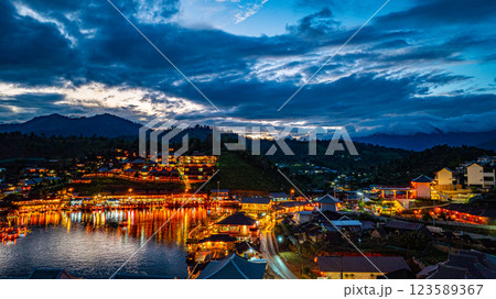 Lights sparkle by the lake in a Chinese village at twilight 123589367
