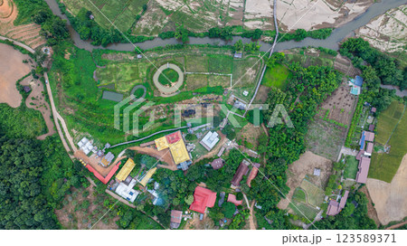 Aerial view of Su Tong Pae bamboo bridge connecting temple to village 123589371