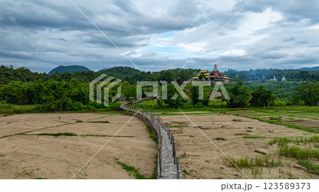 Aerial view of beautiful temple at Boon Ko Ku So Bridge beautiful bamboo bridges Aerial view of beautiful temple at Boon Ko Ku So Bridge beautiful bamboo bridges 123589373