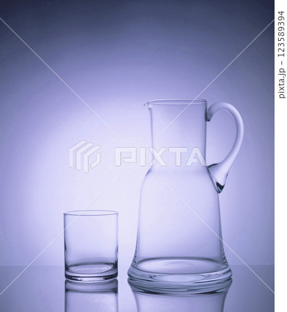 Elegant glassware glowing in the backlight with stunning helium filters 123589394