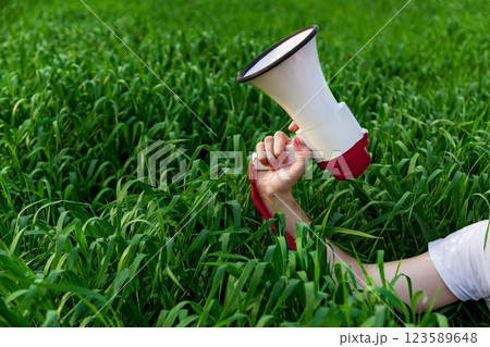 The guy holds a loudspeaker 123589648
