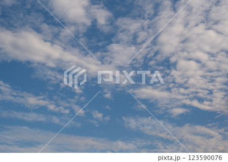 A cloud that is in the sky with the bottom right corner. 123590076
