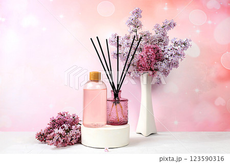 Spa and wellness composition with lilac water, pink salt, aromatic sticks and fresh lilac flowers, spa salon advertising card with space for text. Concept of natural self-care and healthy lifestyle, Spa and wellness composition with lilac water, pink salt, aromatic sticks and fresh lilac flowers, spa salon advertising card with space for text. Concept of natural self-care and healthy lifestyle, 123590316