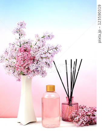 Advertising postcard of spa salon. Wellness composition with lilac water, pink salt, aromatic sticks and fresh lilac flowers, Concept of natural self-care and healthy lifestyle, abstract composition Advertising postcard of spa salon. Wellness composition with lilac water, pink salt, aromatic sticks and fresh lilac flowers, Concept of natural self-care and healthy lifestyle, abstract composition 123590319