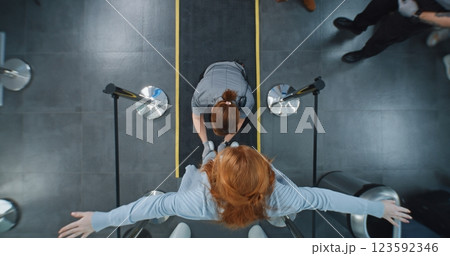 Diverse People Walking Through X-ray Metal Detector, Security Officers Inspecting Passengers 123592346