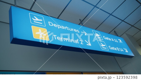Blue Navigation Sign Directing Passengers to Departures, Terminals And Gates Blue Navigation Sign Directing Passengers to Departures, Terminals And Gates 123592398