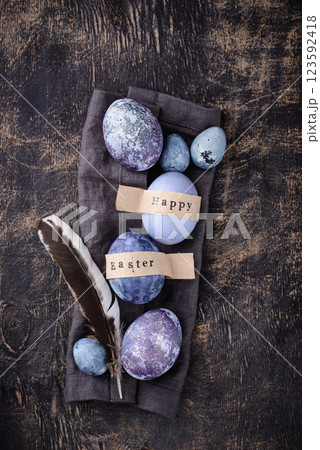 Festive Easter eggs in purple and blue color Festive Easter eggs in purple and blue color 123592418