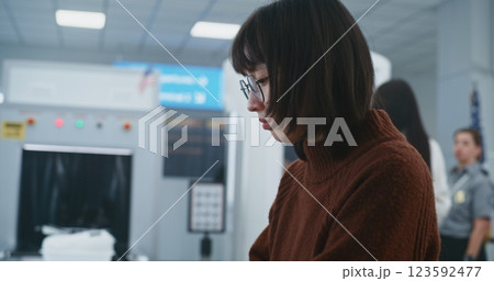 Diverse People Putting Personal Items, Luggage for X-ray Scanning 123592477