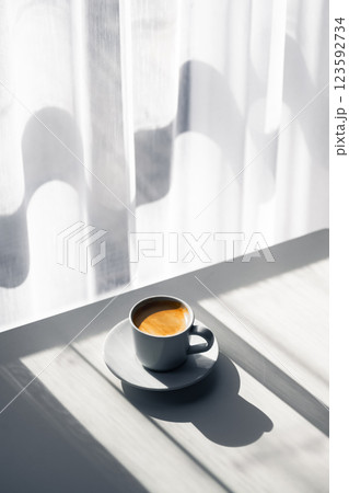 Aromatic espresso in a cup on a wooden table Aromatic espresso in a cup on a wooden table 123592734
