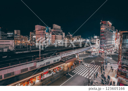 Nightscape of a Busy City Intersection with Illuminated Storefronts, Tokyo Dec 9 2024 Nightscape of a Busy City Intersection with Illuminated Storefronts, Tokyo Dec 9 2024 123605166