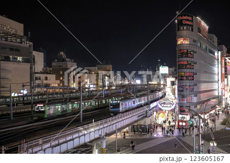 Nightscape of a Busy City Intersection with Illuminated Storefronts, Tokyo Dec 9 2024 123605167
