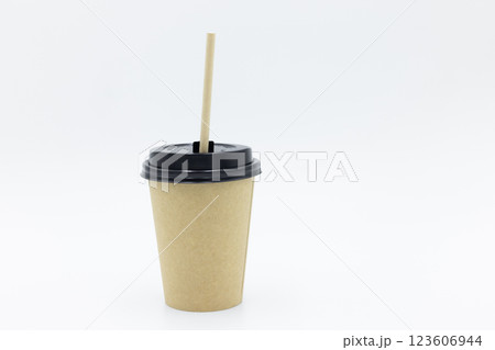 Paper cups and paper straws on white background, Accessories for drinking outdoors, Ecology recycling eco friendly, Eco friendly reusable paper straws, Kraft paper straw for drinking coffee or tea. Paper cups and paper straws on white background, Accessories for drinking outdoors, Ecology recycling eco friendly, Eco friendly reusable paper straws, Kraft paper straw for drinking coffee or tea. 123606944