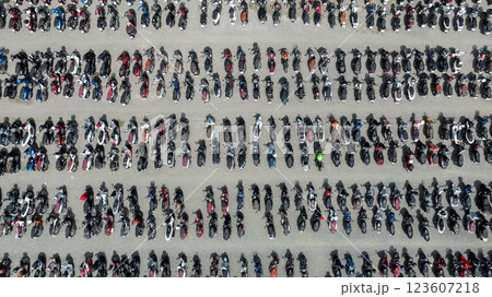Top view row of motorcycles parked on street, Motorcycles parked on the motorcycles parking lot, Aerial view of motorcycles parking row on concrete floor. 123607218