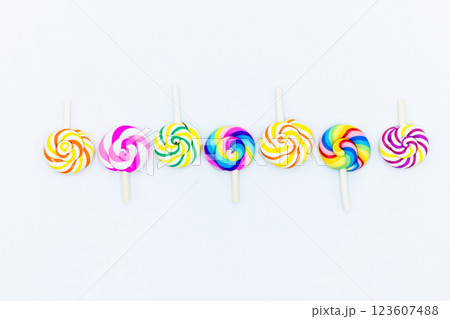 Sweet food lollipop on white background, Set of colorful lollipops isolated on white background, Colorful lollipops swirls, Spiral multicolor candy on white background, Top view 123607488