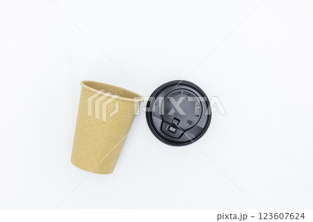 Brown paper coffee cup with black lid on white background, Brown paper cup blank coffee cup for takeaway on white background, Brown empty paper cup for coffee eco coffee cafe. Brown paper coffee cup with black lid on white background, Brown paper cup blank coffee cup for takeaway on white background, Brown empty paper cup for coffee eco coffee cafe. 123607624