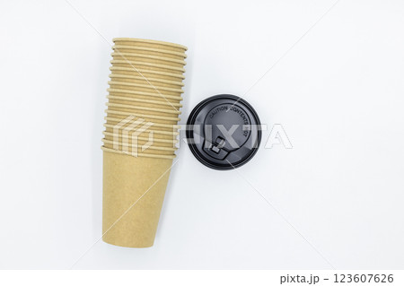 Brown paper coffee cup with black lid on white background, Brown paper cup blank coffee cup for takeaway on white background, Brown empty paper cup for coffee eco coffee cafe. Brown paper coffee cup with black lid on white background, Brown paper cup blank coffee cup for takeaway on white background, Brown empty paper cup for coffee eco coffee cafe. 123607626