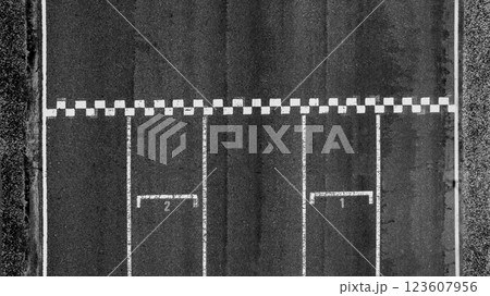 Start or finish line on car race, Start and finish line racing, Grid start race track, Top view textured and background grid start on the asphalt road race track abstract. 123607956