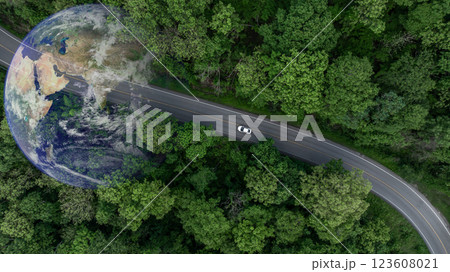 Aerial view EV car electric vehicle car alternative sustainable energy eco power,  EV car electric vehicle car on middle green tree forest road with globe earth planet, Alternative sustainable energy. 123608021