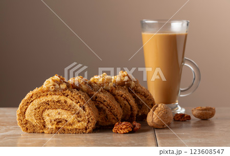 Walnut and buttercream roll: a traditional Oriental pastry. Walnut and buttercream roll: a traditional Oriental pastry. 123608547