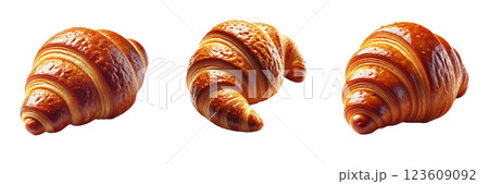 Three croissants are displayed on a white background, highlighting their rich, flaky layers and golden brown crust. The baked goods exhibit tempting shapes and textures, inviting enjoyment 123609092