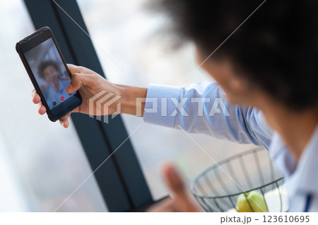 Man looking into phone camera while making selfie Man looking into phone camera while making selfie 123610695