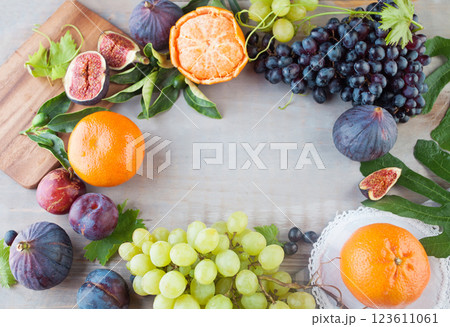 Wooden board with Healthy Fresh Fruit mix and copy cpace, food background 123611061