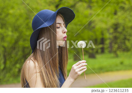 Young adult woman outdoors. Portrait of young beauty model 123611235