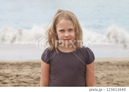 Young child girl on the sea beach, outdoors portrait. Happy holiday Young child girl on the sea beach, outdoors portrait. Happy holiday 123611640