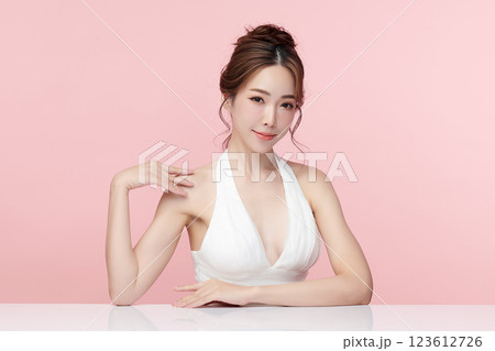 Beautiful young asian woman with clean fresh skin on pink background, Face care, Facial treatment, Cosmetology, beauty and spa, Asian women portrait. Beautiful young asian woman with clean fresh skin on pink background, Face care, Facial treatment, Cosmetology, beauty and spa, Asian women portrait. 123612726