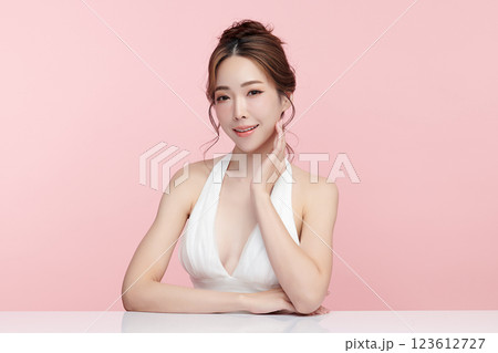 Beautiful young asian woman with clean fresh skin on pink background, Face care, Facial treatment, Cosmetology, beauty and spa, Asian women portrait. 123612727