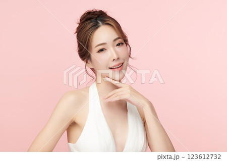 Beautiful young asian woman with clean fresh skin on pink background, Face care, Facial treatment, Cosmetology, beauty and spa, Asian women portrait. 123612732