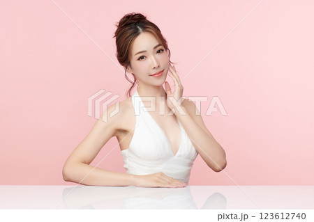 Beautiful young asian woman with clean fresh skin on pink background, Face care, Facial treatment, Cosmetology, beauty and spa, Asian women portrait. 123612740