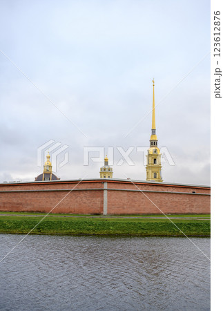 Spire and dome of Peter and Paul Cathedral and fortress wall in St. Petersburg, Russia, in autumn 123612876